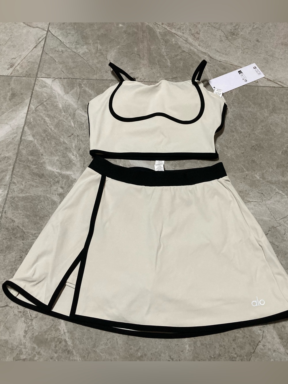 ALO Yoga Cream Two-Piece Crop Top and Skirt with Black Trim